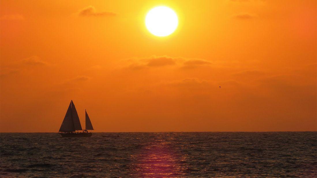 Take your drink outside to enjoy a blazing orange sunset.